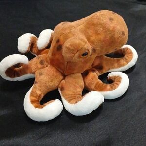 Realistic plush octopus stuffed animal. Orange & brown spotted, white underbelly